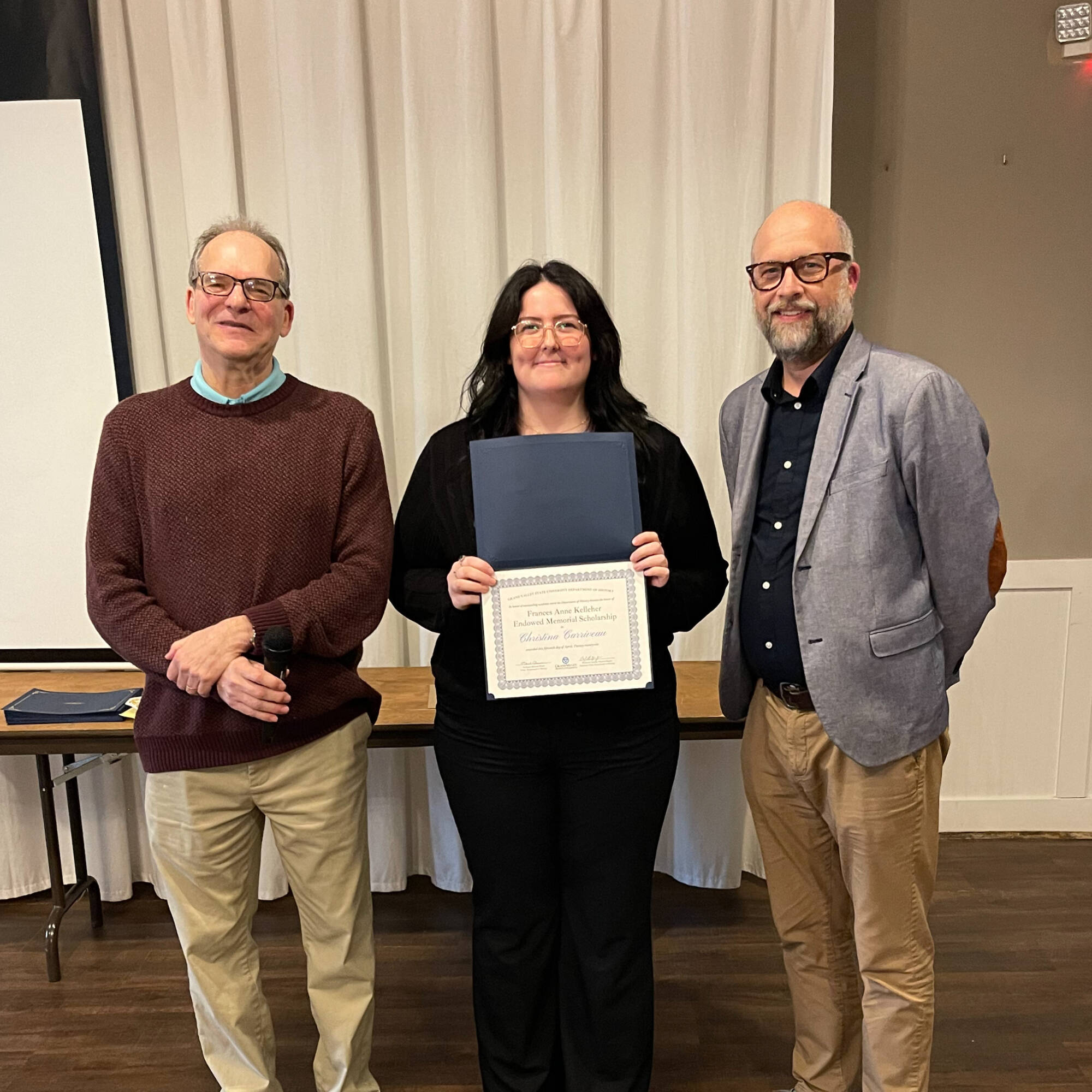 Christina Carriveau holding award with professors Montagna & Huner